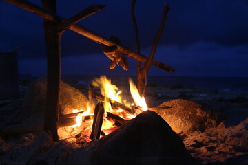 campfire with sea beach background  in evening winter season dark night