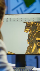 Focused woman architect working at new project using computer doing overtime at night sitting at...