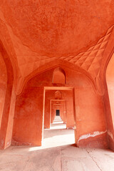 Hallway painted in orange/red color; India