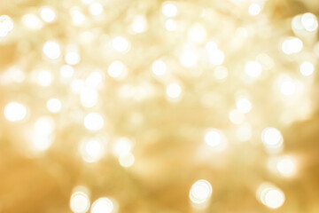 Obraz premium abstract background. light gold blurry lights. bokeh. texture. concept for valentine's day, christmas, new year, holiday