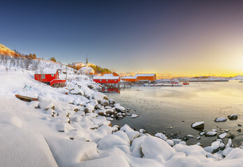 Awesome winter scenery of Moskenes village with ferryport and famous Moskenes parish Churc