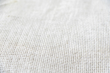 Sackcloth texture or background fading into blurred edges. 