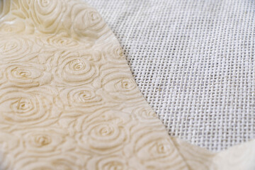 Sackcloth and paper texture or background fading into blurred edges. 