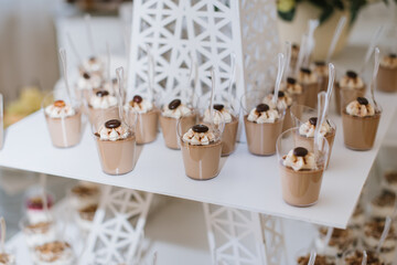 Many different desserts in the candy bar on wedding