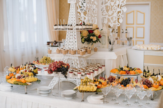 Many different desserts in the candy bar on wedding