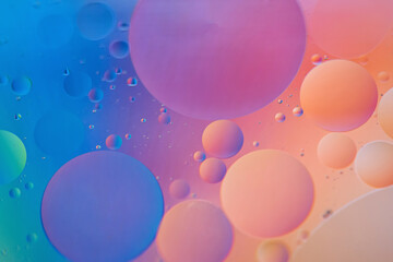 Oil drops in water. Defocused abstract psychedelic pattern image orange and blue colored. Abstract...