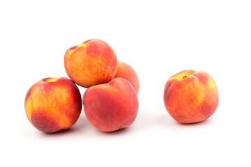 Fototapeta na wymiar Summer fruit background. Ripe juicy peaches on white background. Copy space. Fresh organic fruit vegan food. Harvest concept