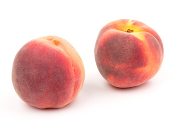 Summer fruit background. Ripe juicy peaches on white background. Copy space. Fresh organic fruit vegan food. Harvest concept