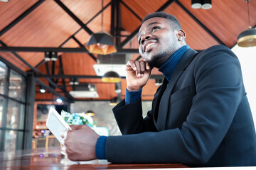 African businessman having a happy time with good idea thinking