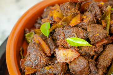 Closeup of a very tasty coconut beef fry in Kerala style preparation