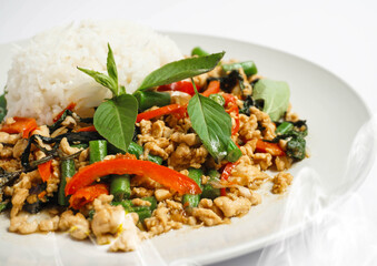 Thai Stir-Fried Basil Chicken with Rice, Khao Pad Ka Prao. Phat kaphrao, also spelled pad krapow, kaprao. Popular Thai à la carte dishes.