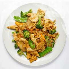 Thai Stir-Fried Noodle with Chicken and Vegetable, Pad See-ew, Top shot. Chinese-influenced stir-fried noodle dish. Fried soy sauce.