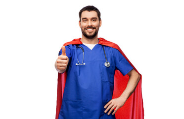 healthcare, profession and medicine concept - happy smiling doctor or male nurse in blue uniform and red superhero cape with stethoscope showing thumbs up over white background