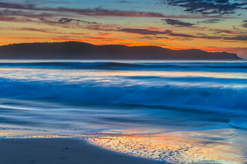 Pretty blue summer sunrise seascape with high cloud