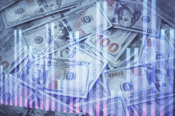 Fototapeta premium Double exposure of forex graph drawing over us dollars bill background. Concept of financial markets.