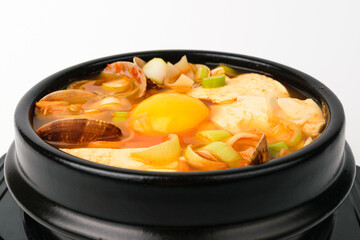 Sundubu jjigae on white background