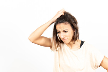 Fototapeta premium A despaired and worried brunette young woman. Mental health and psychology concept.