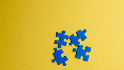 scattered puzzle pieces on colored background