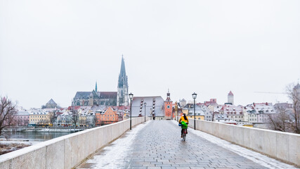 Regensburg City trip in winter time. View from the stone bridge