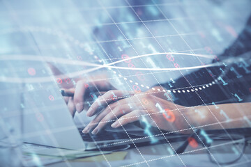 Multi exposure of woman hands typing on computer and financial graph hologram drawing. Stock market analysis concept.