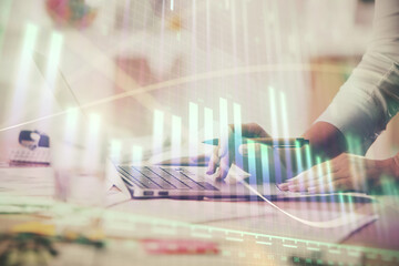 Multi exposure of woman hands typing on computer and financial chart hologram drawing. Stock market analysis concept.