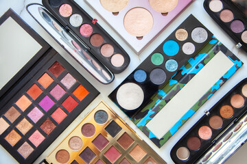 Flat lay of various of waterproof contour, eyeshadow palette collection with vivid and pastel colors