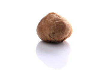fermented black garlic on white background