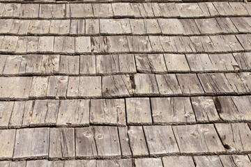 Natural pine wood panels from a wooden roof of a mountain stable