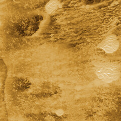 Gold ink and watercolor texture on white paper background. Paint leaks and decalcomania effects. Hand-painted gouache abstract image. Mess on the canvas.