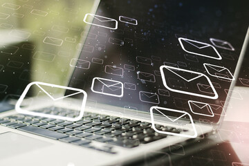 Creative abstract postal envelopes sketch on modern laptop background, e-mail and marketing concept. Double exposure