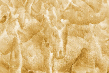 Gold ink and watercolor texture on white paper background. Paint leaks and decalcomania effects. Hand-painted gouache abstract image. Mess on the canvas.