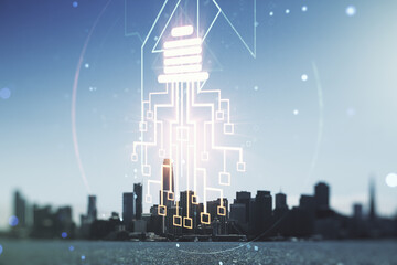Fototapeta na wymiar Double exposure of virtual creative light bulb hologram with chip on San Francisco city skyscrapers background, idea and brainstorming concept