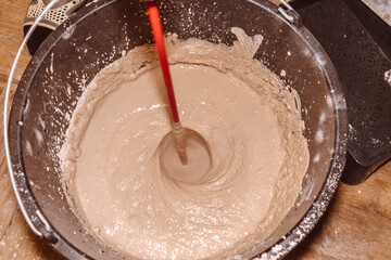 preparing a mortar plaster stirring mix water consistency emulsion finishing