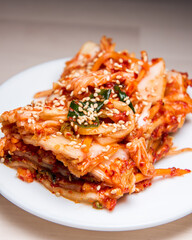 Kimchi cabbage in white bowl, small portion