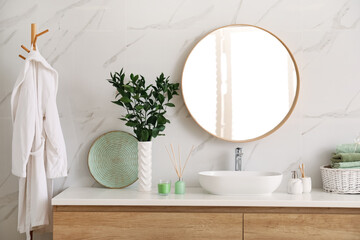 Modern bathroom interior with stylish mirror and vessel sink
