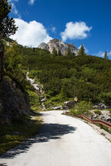 Fototapeta na wymiar Breathtaking panorama of the Fedaia pass dam in the Dolomites. Border between Trentino Alto Adige and Veneto
