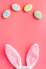 Naklejka na ściany i meble Happy Easter background. Bunny ears with eggs cookies, space for text