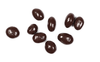 Chocolate coated raisins pile isolated on white background