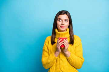 Portrait of pretty bewildered girl drinking cacao thinking copy space clue isolated over bright...