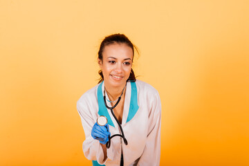 Portrait of beautiful African American doctor or nurse isolated over yellow background