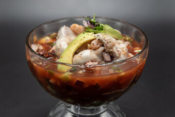 Cup of aphrodisiac ingredients of shellfish including oysters for a delicious blend of flavors.