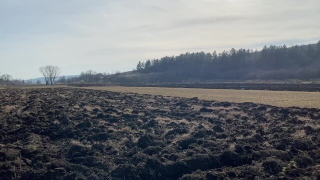 Panoramic view of the tilled field in the countryside in winter