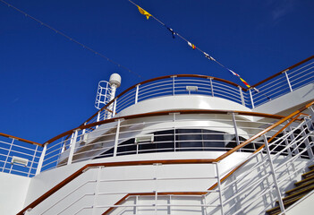 Outdoor stairs or staircase with deck and superstructure of modern cruiseship or cruise ship liner...