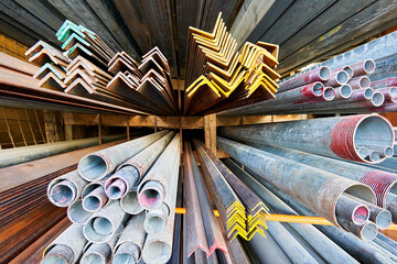 Close-up wide-angle view of aluminum bars and metal steel pipes for sale at a hardware store in the Philippines, Asia