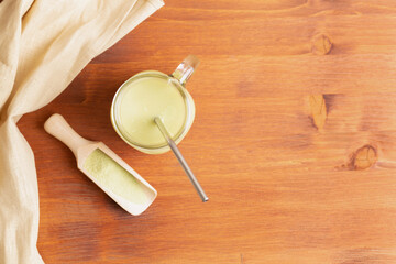 Green Tea matcha in glass mason jar and spice spatula