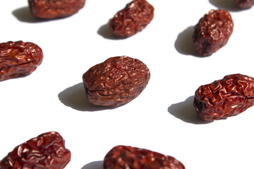 close up Red dates on white background.
