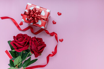 Gift or present box and red rose on pink background. for banner. The concept of Valentine Day. top view, copy space