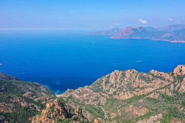 Aerial view of beautiful view of sunlit red mountains and the Mediterranean Sea with the Bay of...