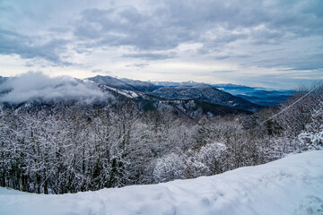 Fototapeta na wymiar Mountain scape from the Sacro Monte after a snowfall in January, Varese, Italy