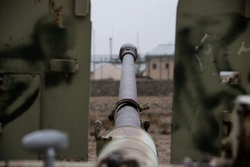 Old armoured vehicles military escorts, guns and tanks in Gardez in Afghanistan